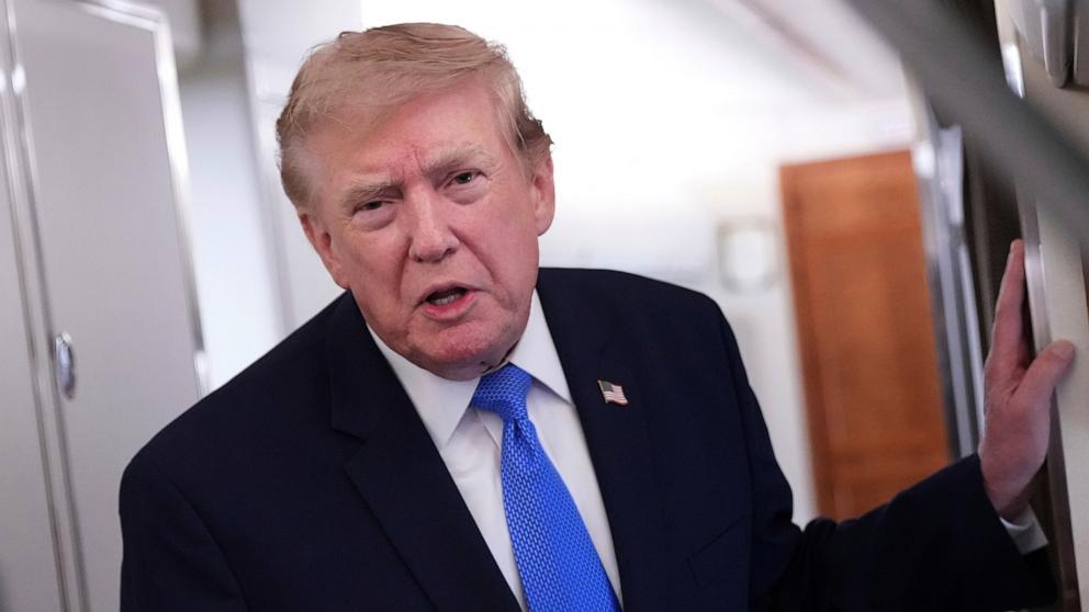 PHOTO: President Donald Trump speaks to the media aboard Air Force One enroute to Joint Base Andrews, in Maryland, August 2, 2026. 