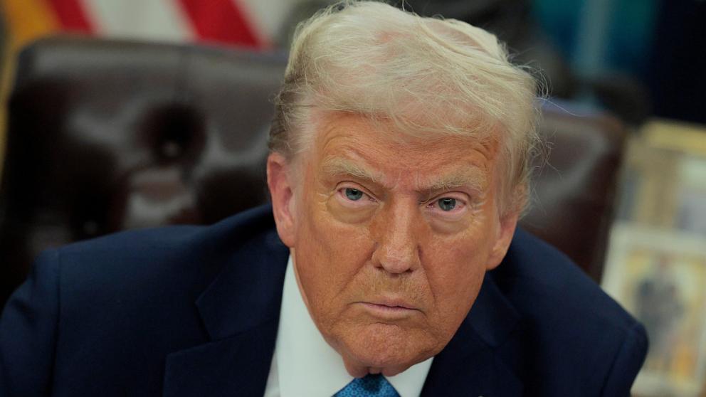 PHOTO: President Donald Trump talks to reporters after signing an executive order in the Oval Office, Jan. 31, 2025, in Washington.