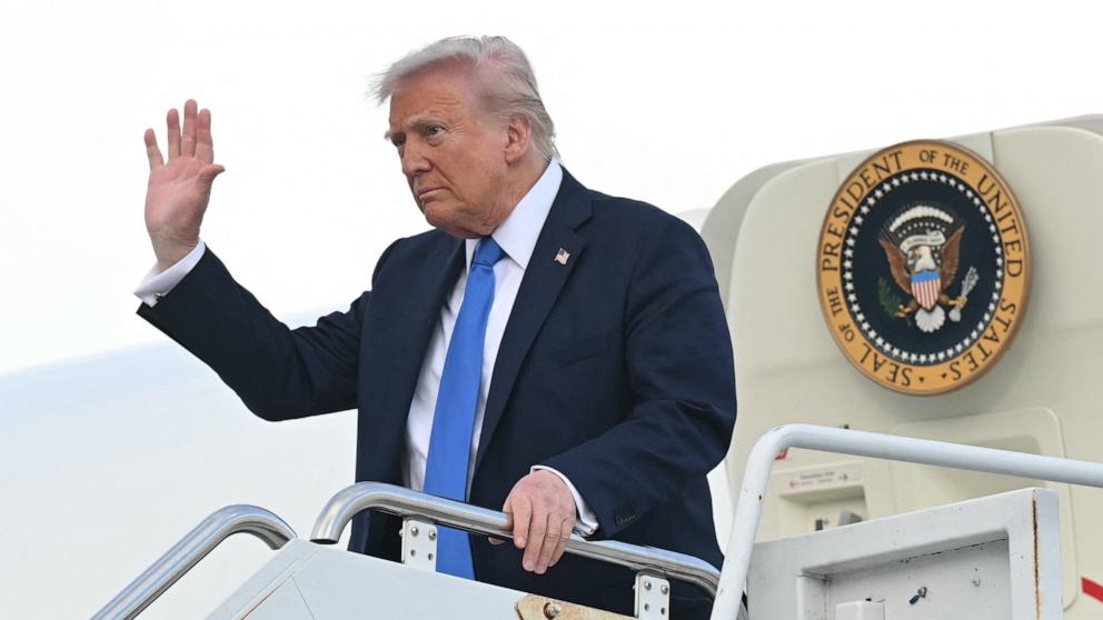 PHOTO: President Donald Trump waves as he steps off of Air Force One upon arrival at Tuscaloosa National Airport in Tuscaloosa, Alabama, May 1, 2025.