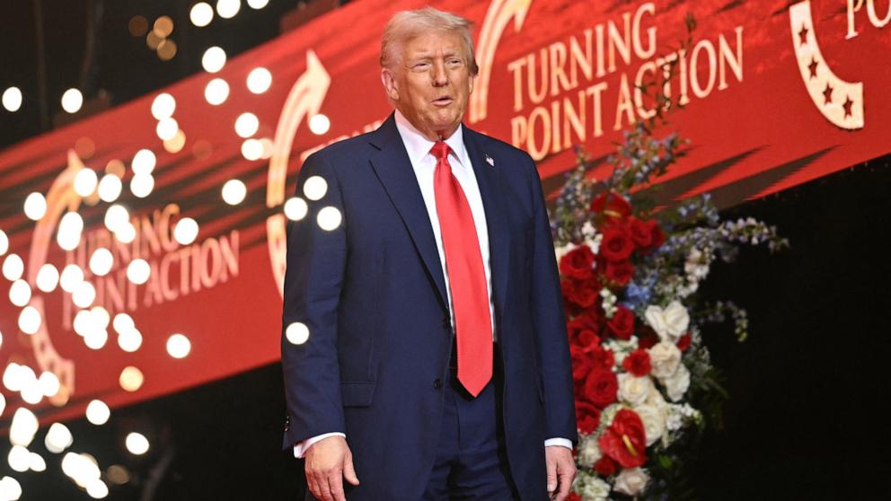 PHOTO: President Donald Trump arrives on stage during the public memorial service for right-wing activist Charlie Kirk, in Glendale, Arizona, September 21, 2025. 