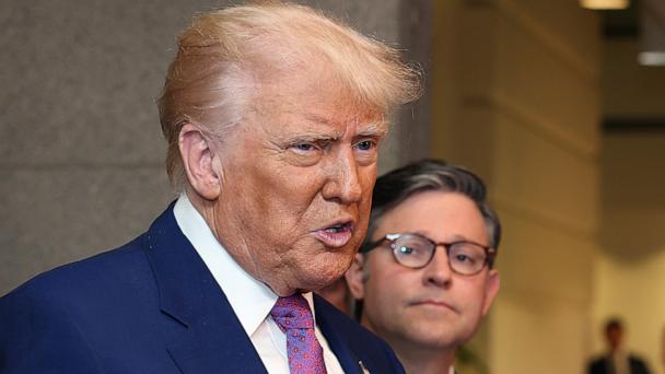 With Speaker of the House Mike Johnson by his side President Donald Trump speaks to the press following a House Republican meeting at the U.S. Capitol, May 20, 2025 in Washington.