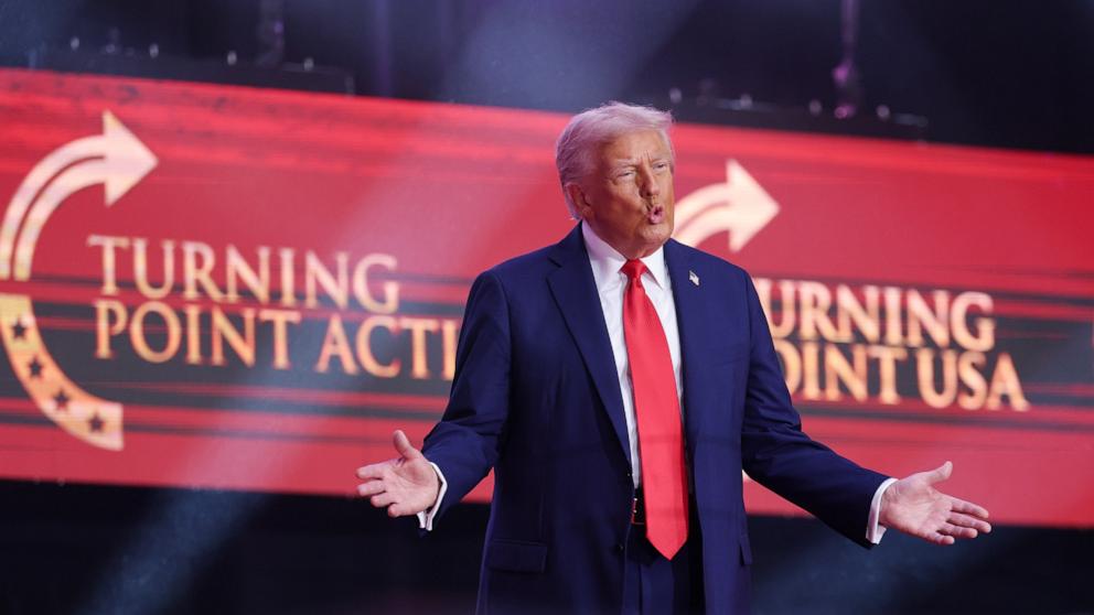 PHOTO: President Donald Trump arrives on stage during the public memorial service for right-wing activist Charlie Kirk, in Glendale, Arizona, September 21, 2025.