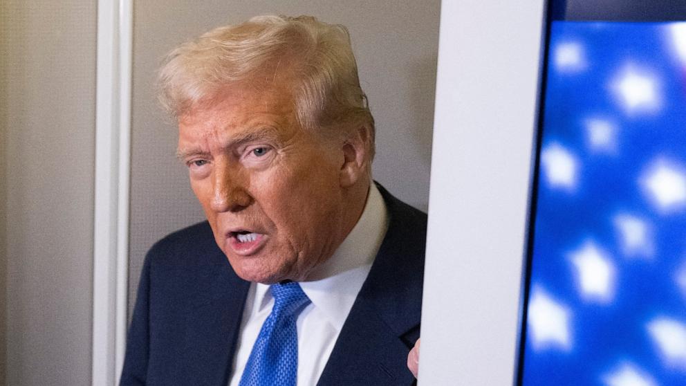 PHOTO: President Donald Trump speaks to reporters aboard Air Force One on his return to Washington, Mar. 9, 2025.