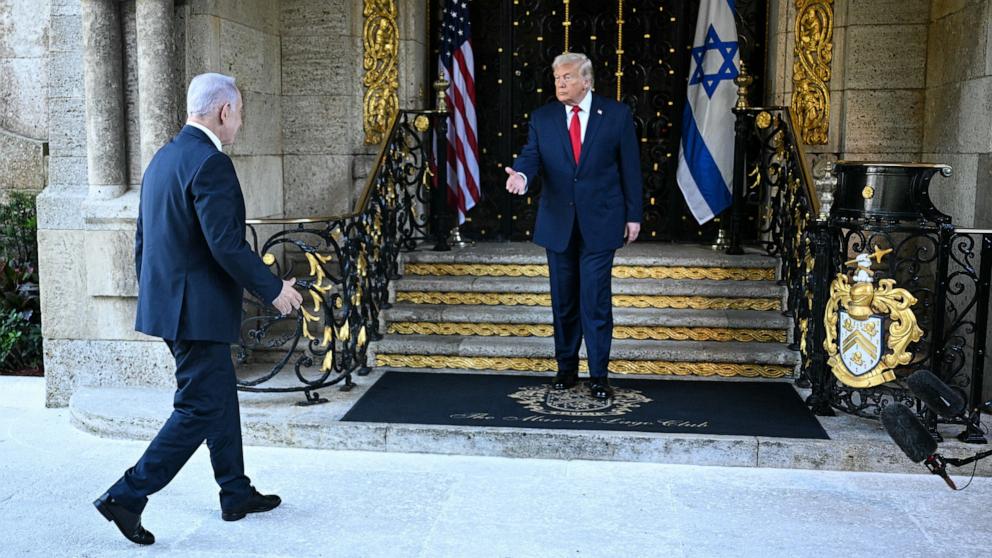 PHOTO: President Donald Trump greets Israeli Prime Minister Benjamin Netanyahu upon arrival at Trump's Mar-a-Lago residence in Palm Beach, Fla., December 29, 2025. 