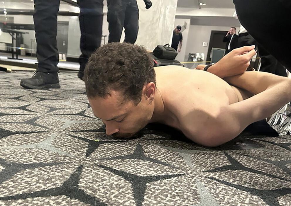 PHOTO: Law enforcement detains a suspect in the shooting at the White House Correspondents' Association dinner, in Washington, April 25, 2026.