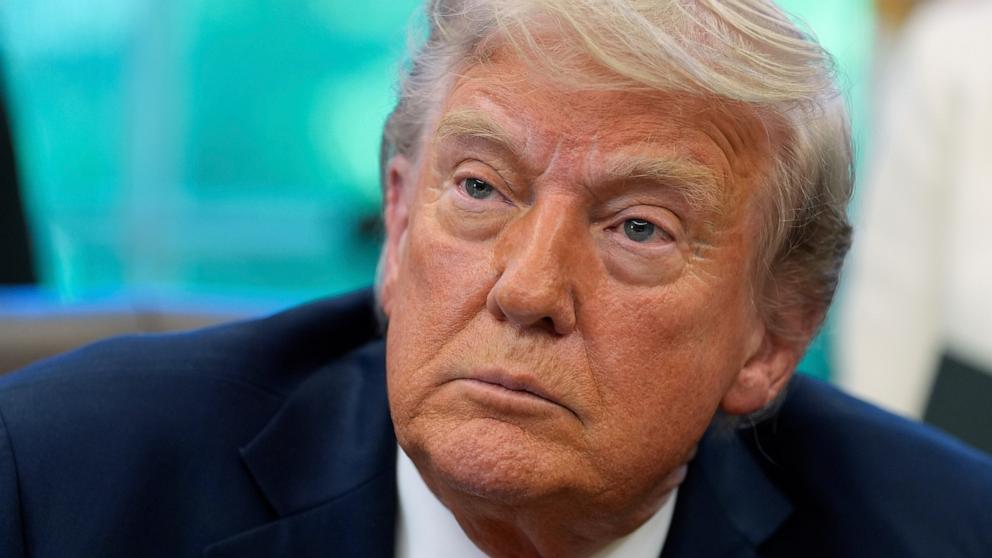 PHOTO: President Donald Trump speaks with reporters after signing executive orders in the Oval Office of the White House, April 23, 2025, in Washington.