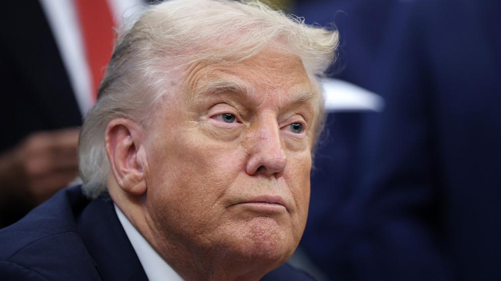 PHOTO: President Donald Trump answers questions while childhood cancer survivors and their families gather in the Oval Office at the White House, September 30, 2025 in Washington.