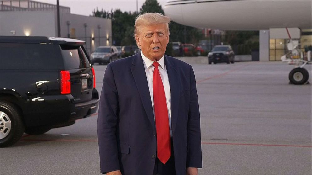 PHOTO: Former U.S. President Donald Trump speaks to the media at Atlanta Hartsfield-Jackson International Airport after surrendering at the Fulton County jail, Aug. 24, 2023 in Atlanta.