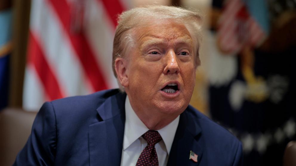 PHOTO: President Donald Trump answers a reporter's question as he chairs a Cabinet meeting in the Cabinet Room of the White House in Washington, August 26, 2025.