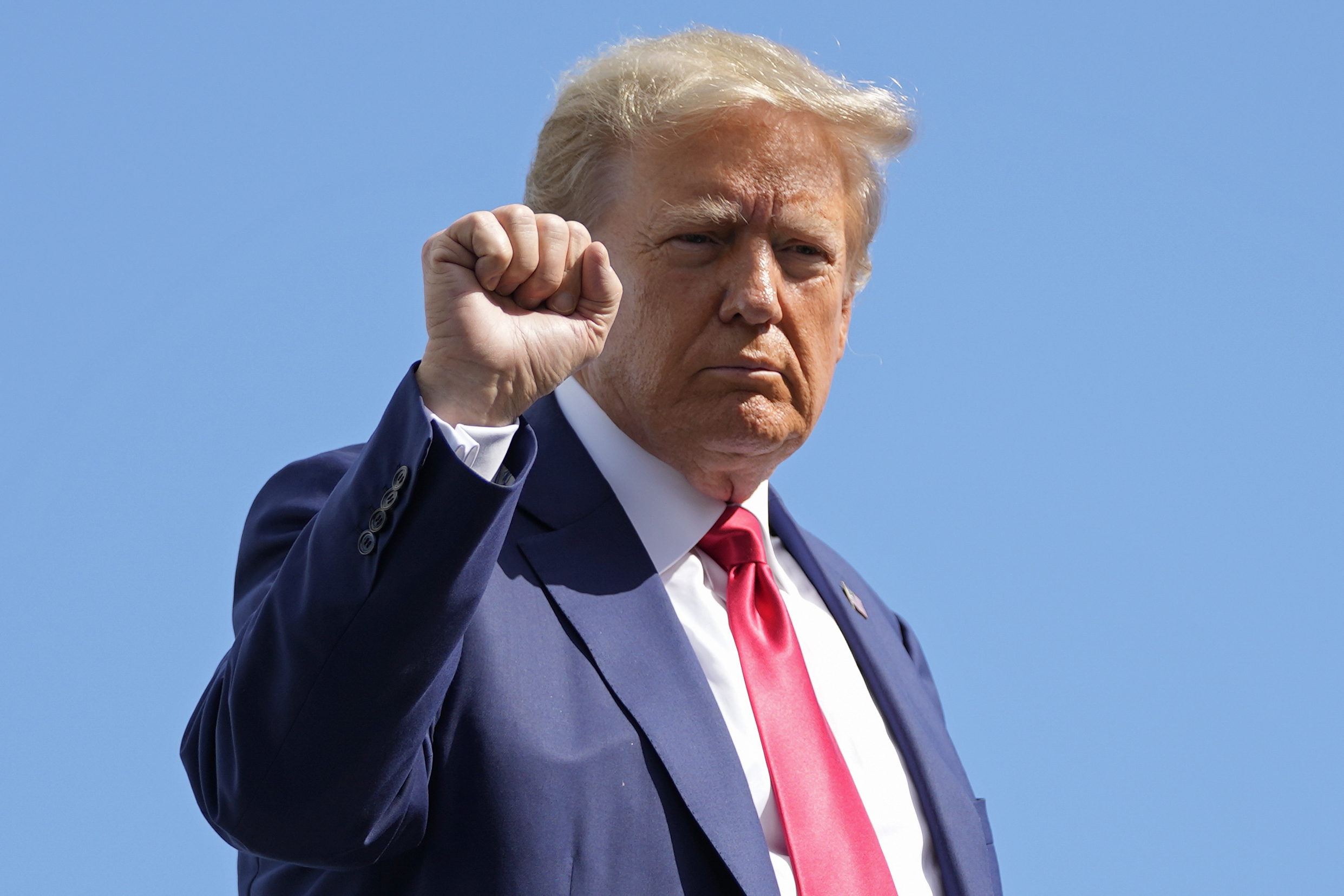 PHOTO: Former President Donald Trump gestures before boarding his personal plane at the Miami International Airport, June 13, 2023.