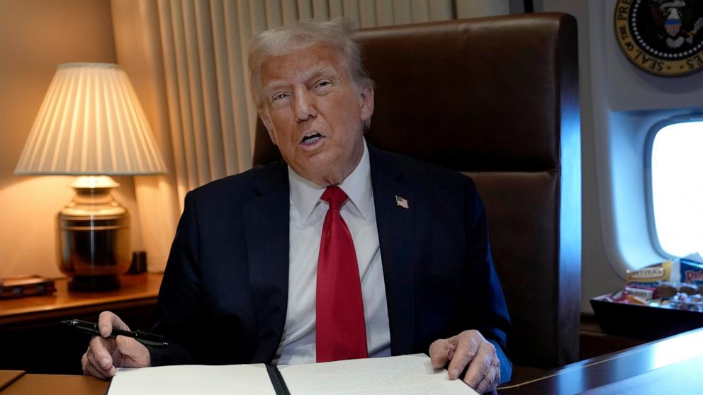 PHOTO: President Donald Trump speaks to the press after signing a proclamation renaming the Gulf of Mexico as the Gulf of America aboard Air Force One, as it flies over the Gulf enroute to New Orleans, Feb. 9, 2025.