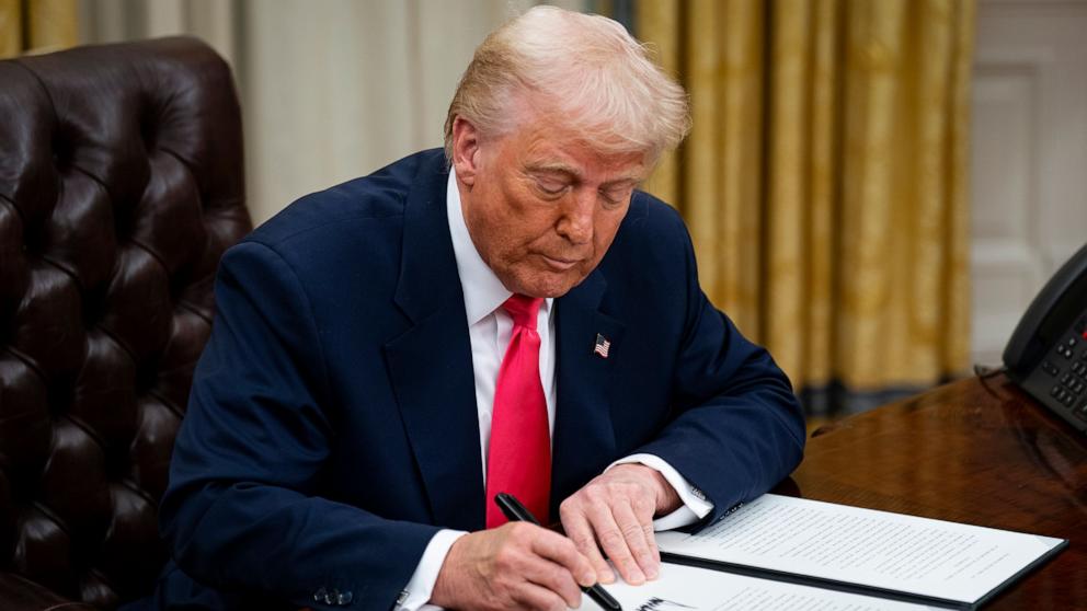 PHOTO: President Donald Trump signs an executive order in the Oval Office of the White House in Washington, Mar. 6, 2025. 