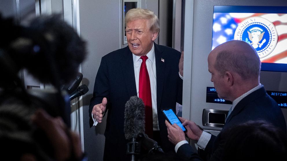 PHOTO: President Donald Trump speaks to the media aboard Air Force One, November 25, 2025 in flight en route to Florida. 