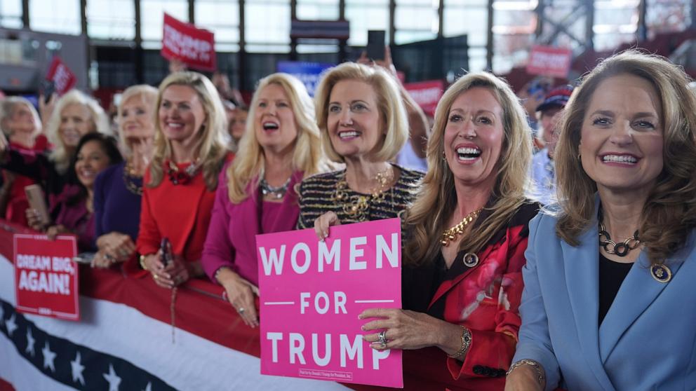 PHOTO: Women for Republican presidential nominee former President Donald Trump show their support as he arrives to speak during a campaign rally at J.S. Dorton Arena, Nov. 4, 2024, in Raleigh, N.C.