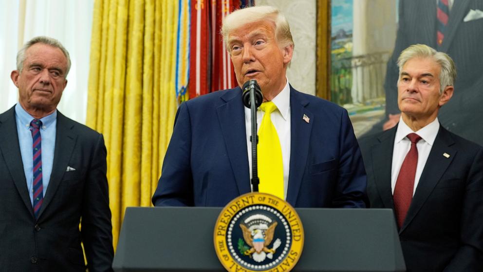 PHOTO: President Donald Trump speaks as Health and Human Services Secretary Robert F. Kennedy Jr., and Dr. Mehmet Oz, listen during a swearing in ceremony for Oz in the Oval Office of the White House, April 18, 2025, in Washington.