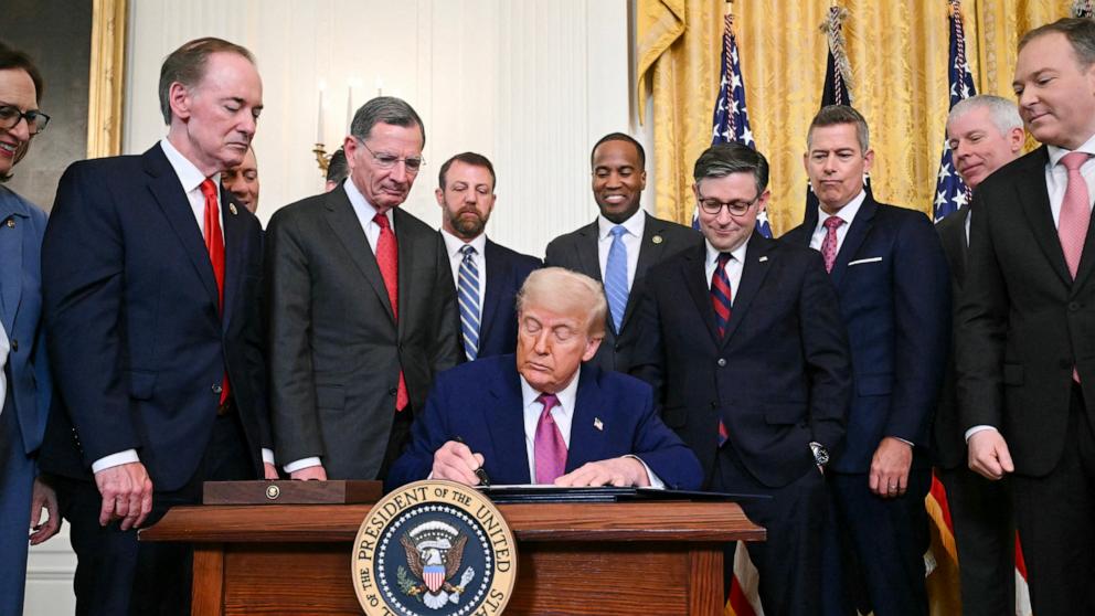 PHOTO: President Donald Trump signs a bill blocking California's rule banning the sale of new gas-powered cars by 2035 in the East Room of the White House in Washington, June 12, 2025.