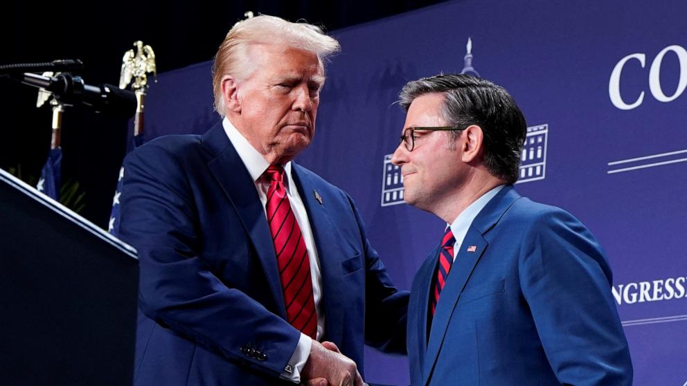 PHOTO: President Donald Trump and Speaker of the House Mike Johnson shake hands during a House Republican members conference meeting in Trump National Doral resort, in Miami, Florida, Jan. 27, 2025.