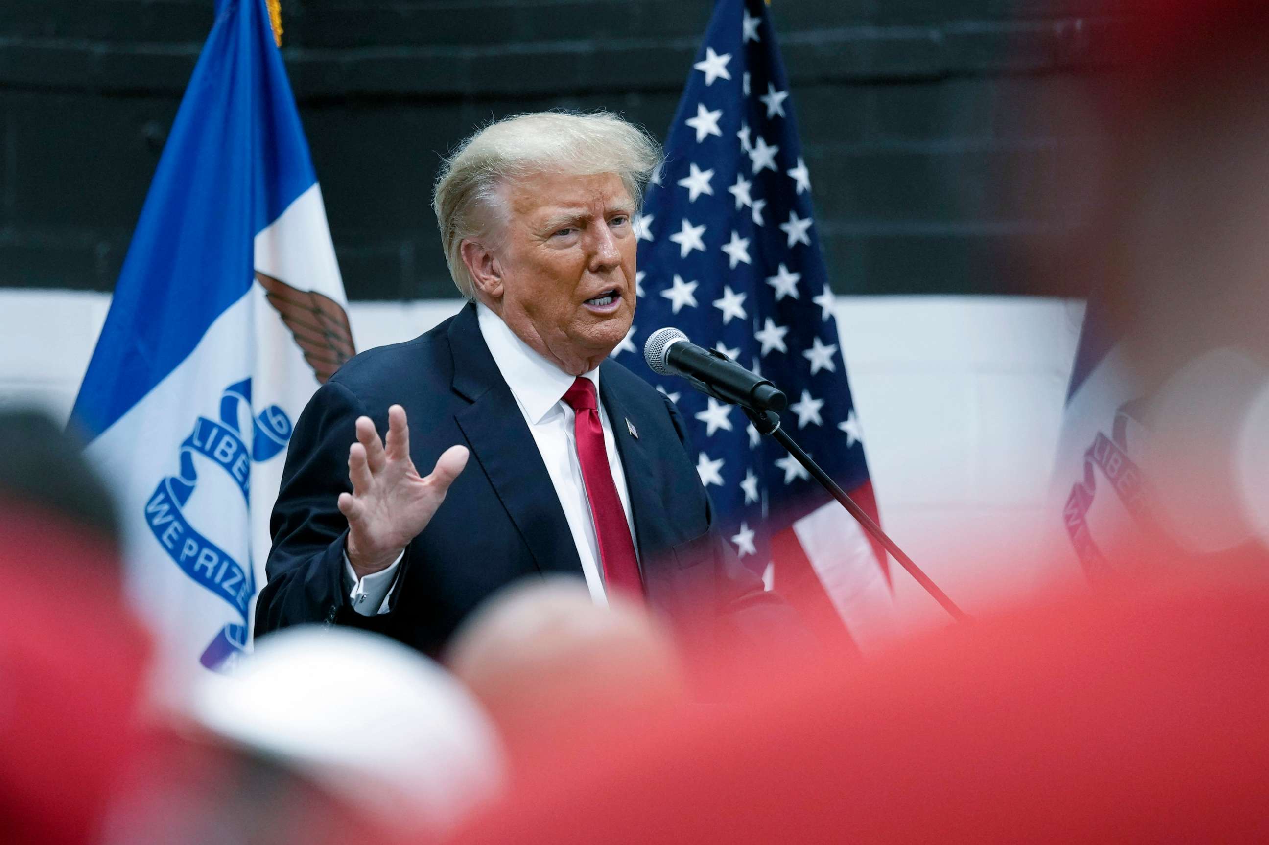 PHOTO: Former President Donald Trump visits with campaign volunteers at the Grimes Community Complex Park, June 1, 2023, in Des Moines, Iowa.