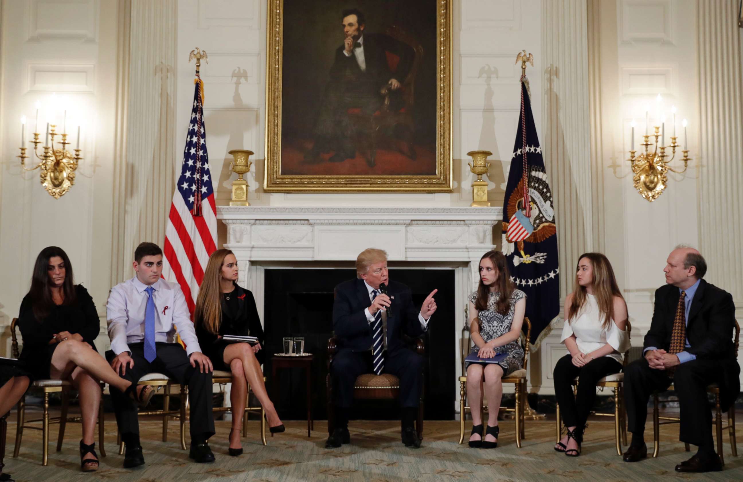 PHOTO: President Donald Trump speaks as he hosts a listening session with high school students, teachers and parents in the State Dining Room of the White House in Washington, D.C., Feb. 21, 2018.