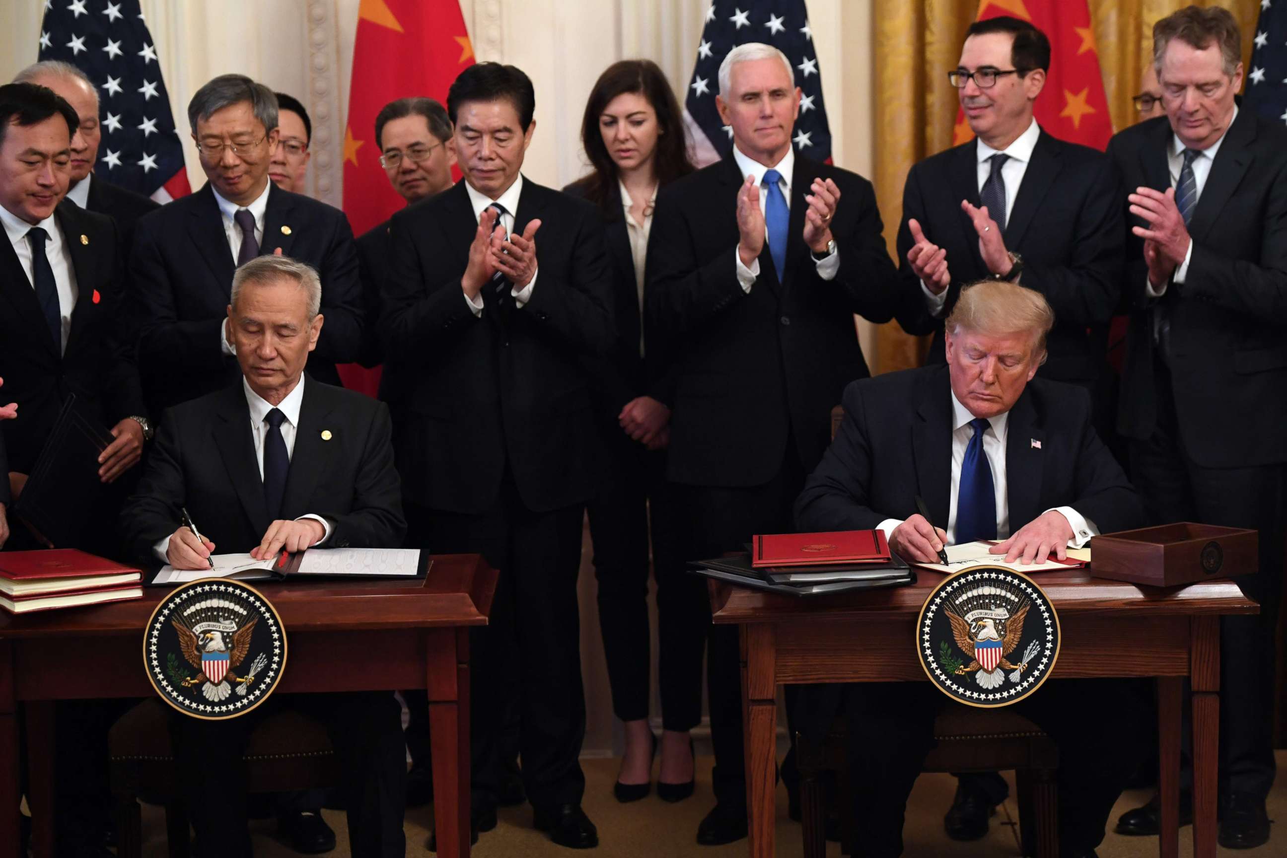 PHOTO: President Donald Trump and Chinese Vice Premier Liu He, sign a trade agreement between the U.S. and China during a ceremony in the East Room of the White House in Washington, Jan. 15, 2020.