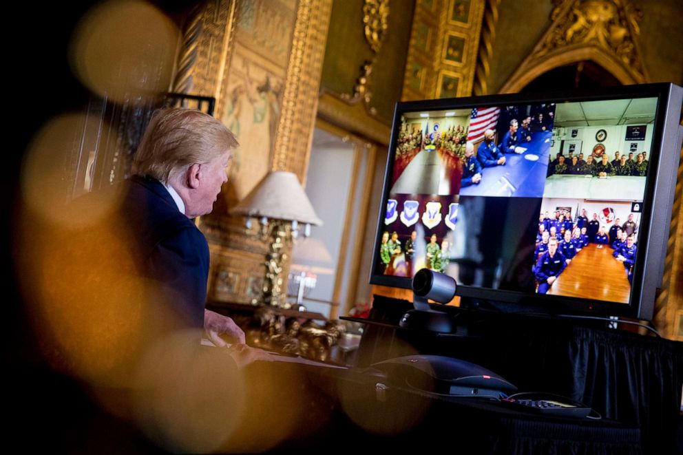 PHOTO: President Donald Trump speaks during a Christmas Eve video teleconference with members of the military at his Mar-a-Lago estate in Palm Beach, Fla., Dec. 24, 2019.