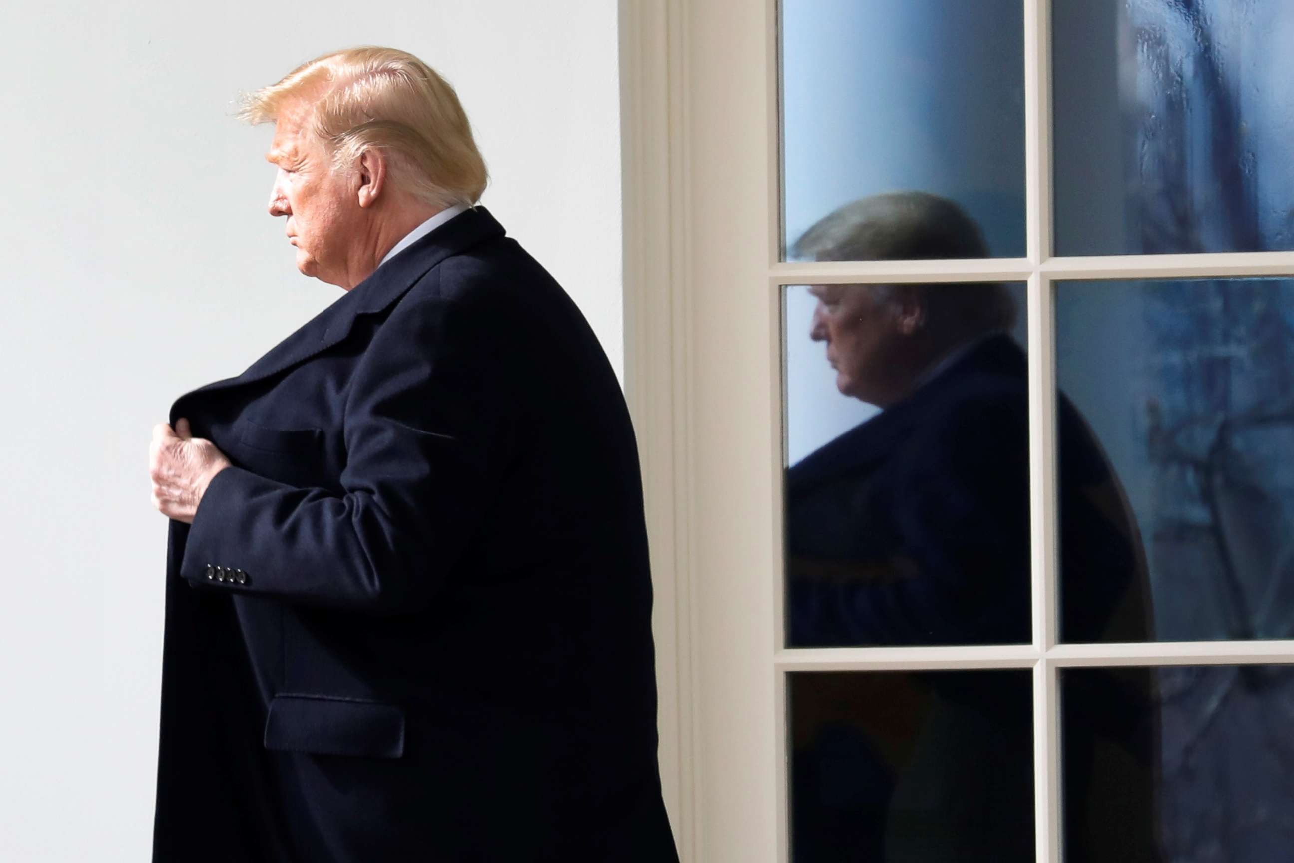 PHOTO: President Donald Trump walks from the Oval Office of the White House in Washington, before his departure to Michigan and Iowa, Jan. 30, 2020.