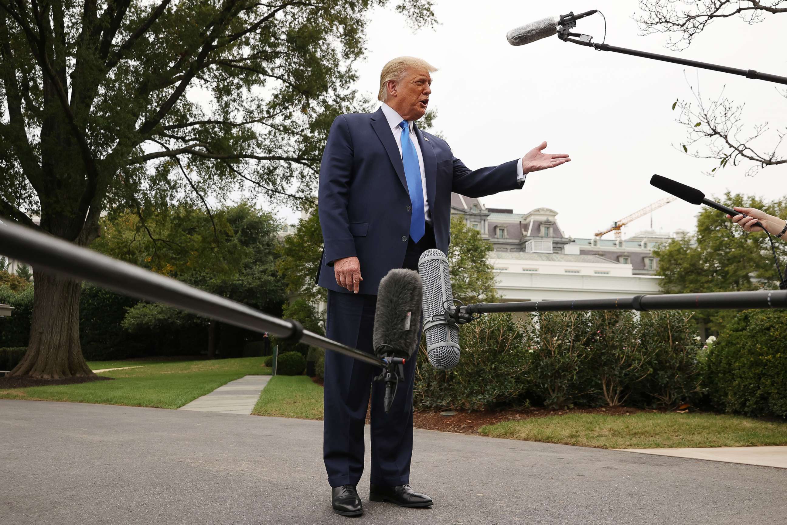 PHOTO: President Donald Trump talks to journalists before departing the White House, Sept. 24, 2020, in Washington.