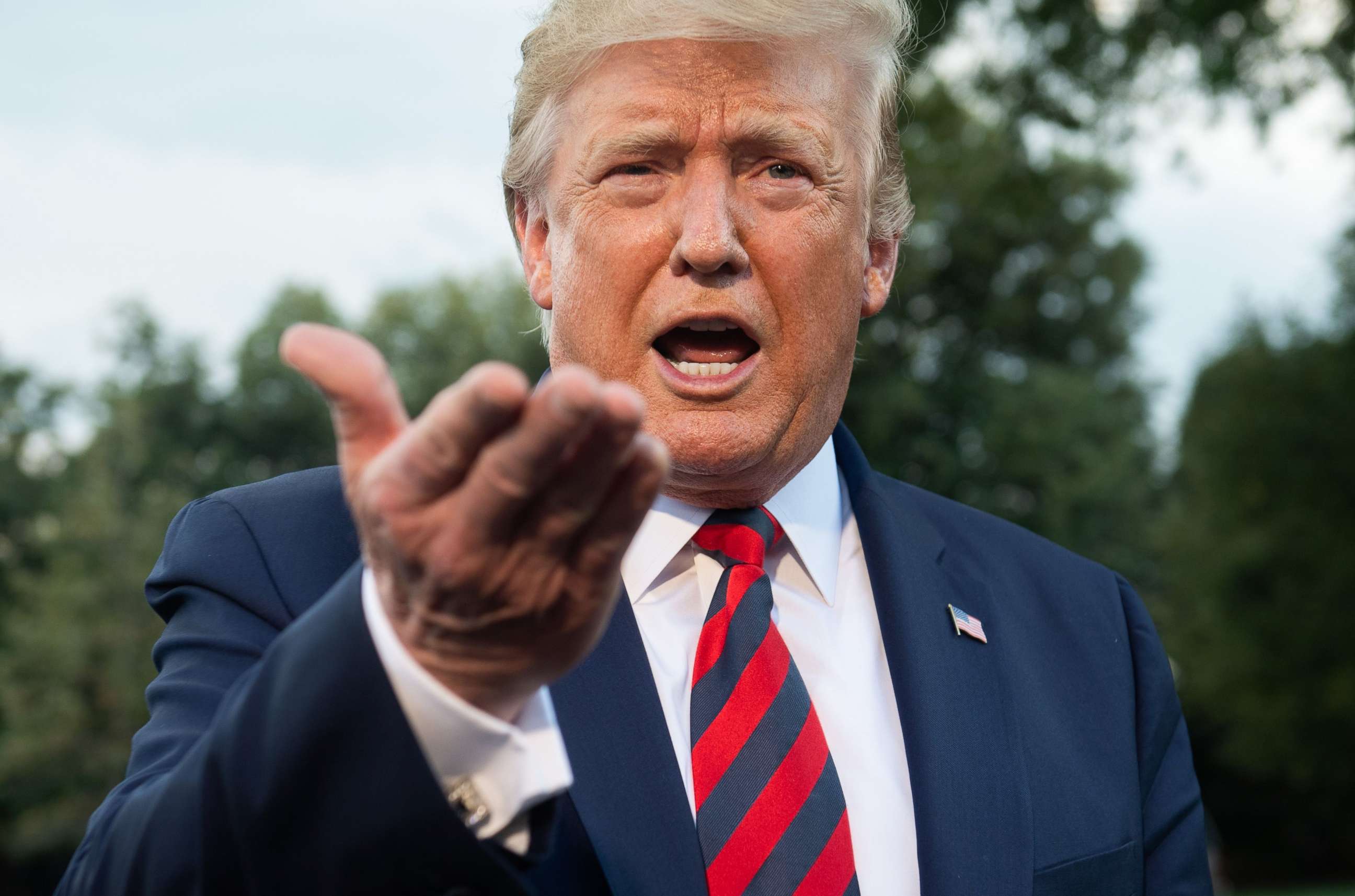 PHOTO: President Donald Trump speaks to the media prior to departing for Baltimore on Marine One from the South Lawn of the White House in Washington, Sept. 12, 2019.