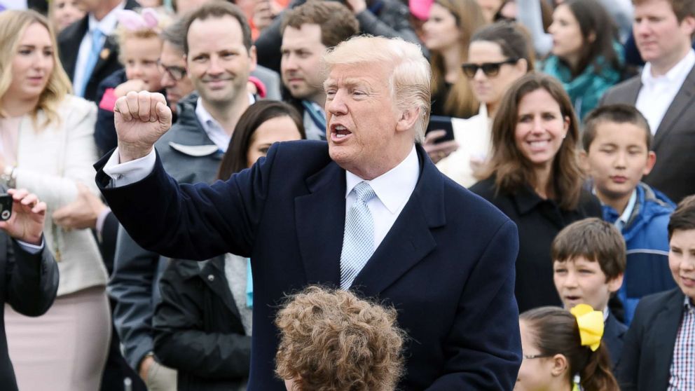 President Donald Trump greets the crowd during the annual Easter Egg Roll on the South Lawn of the White House in Washington, April 2, 2018.