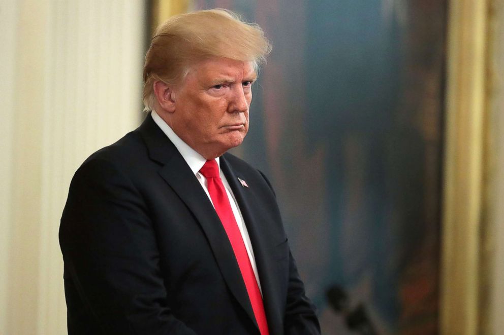 PHOTO: President Donald Trump listens to the opening prayer during Air Force Technical Sergeant John Chapman's Medal of Honor ceremony at the White House, Aug. 22, 2018, in Washington, DC.