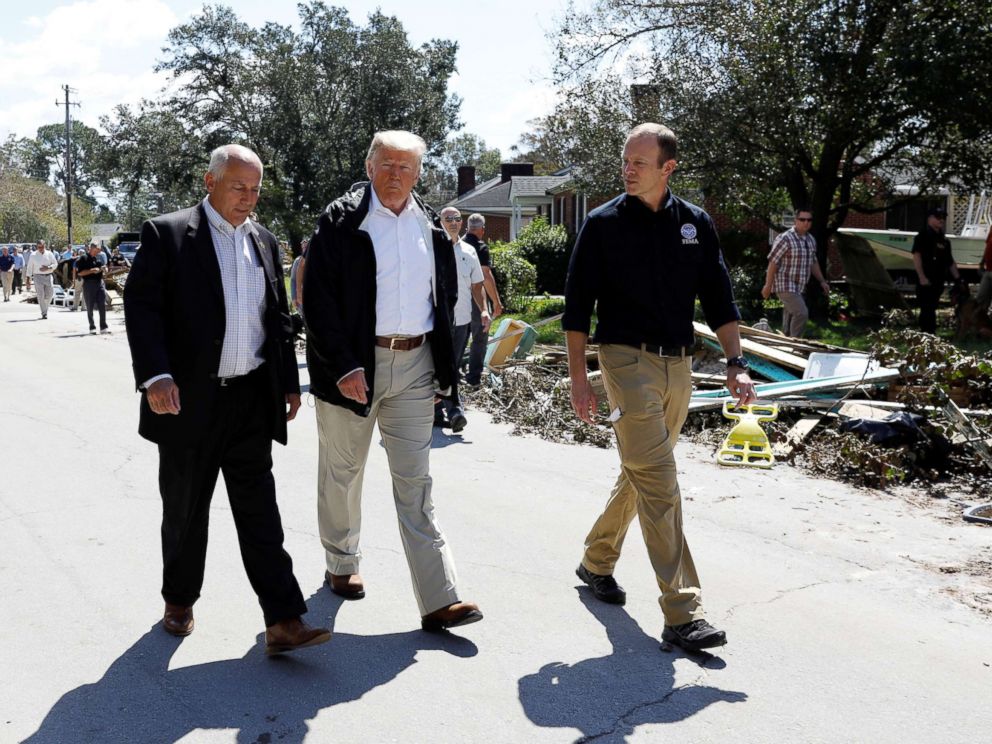 PHOTO: President Donald Trump walks down a street while on a tour of Hurricane Florence recovery efforts in New Bern, N.C., Sept. 19, 2018.
