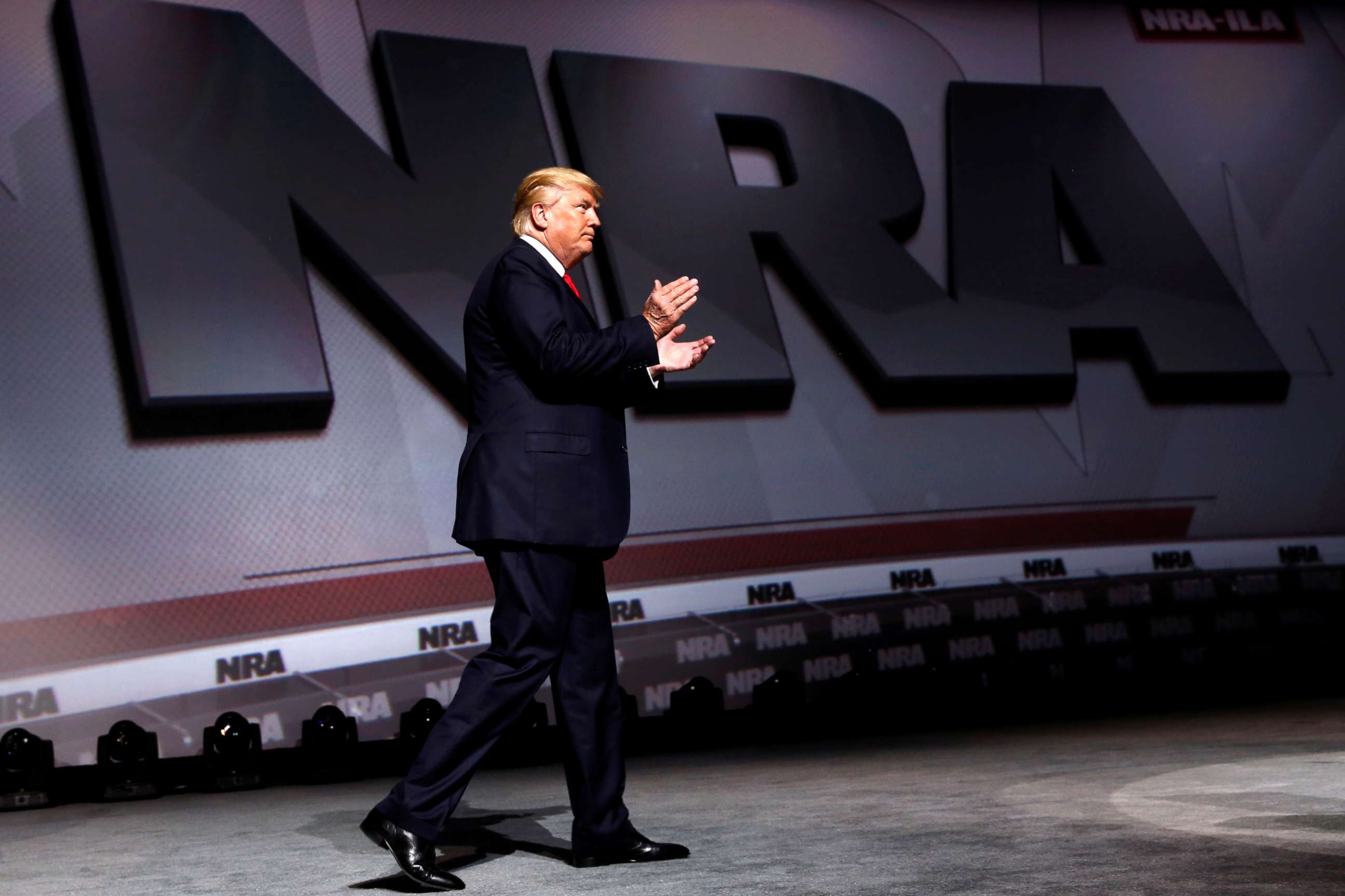 PHOTO: President Donald Trump arrives onstage to deliver remarks at the National Rifle Association Leadership Forum at the Georgia World Congress Center in Atlanta, April 28, 2017.