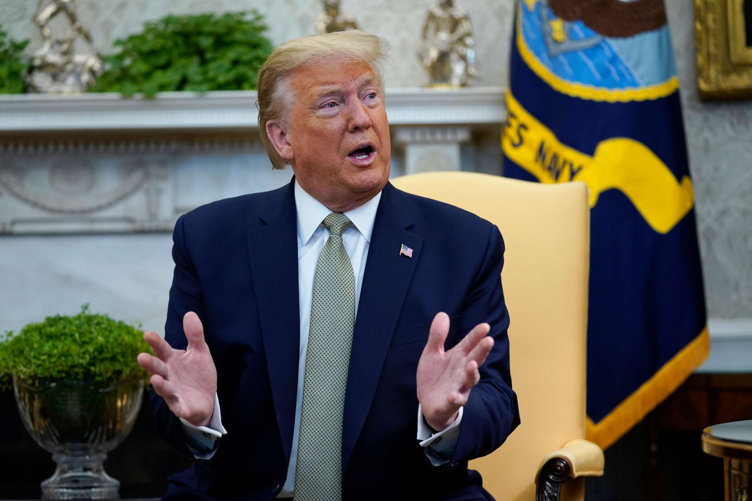 PHOTO: President Donald Trump speaks in the Oval Office of the White House, March 12, 2020, in Washington.