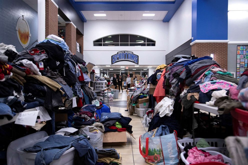 PHOTO: Donations are arranged in the hallway of South Warren High School the night after tornadoes hit Bowling Green, at Bowling Green, Ky., Dec. 11, 2021.