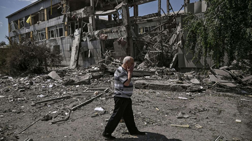 PHOTO: A local resident reacts in front of a destroyed school after a strike in the city of Bakhmut, eastern Ukrainian region of Donbas, June 8, 2022.