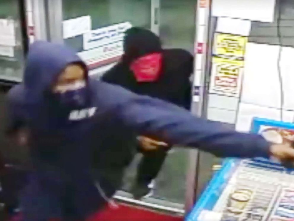 PHOTO: Police released surveillance video of two men they say gunned down a mother who was working as a store clerk at a Houston gas station. 