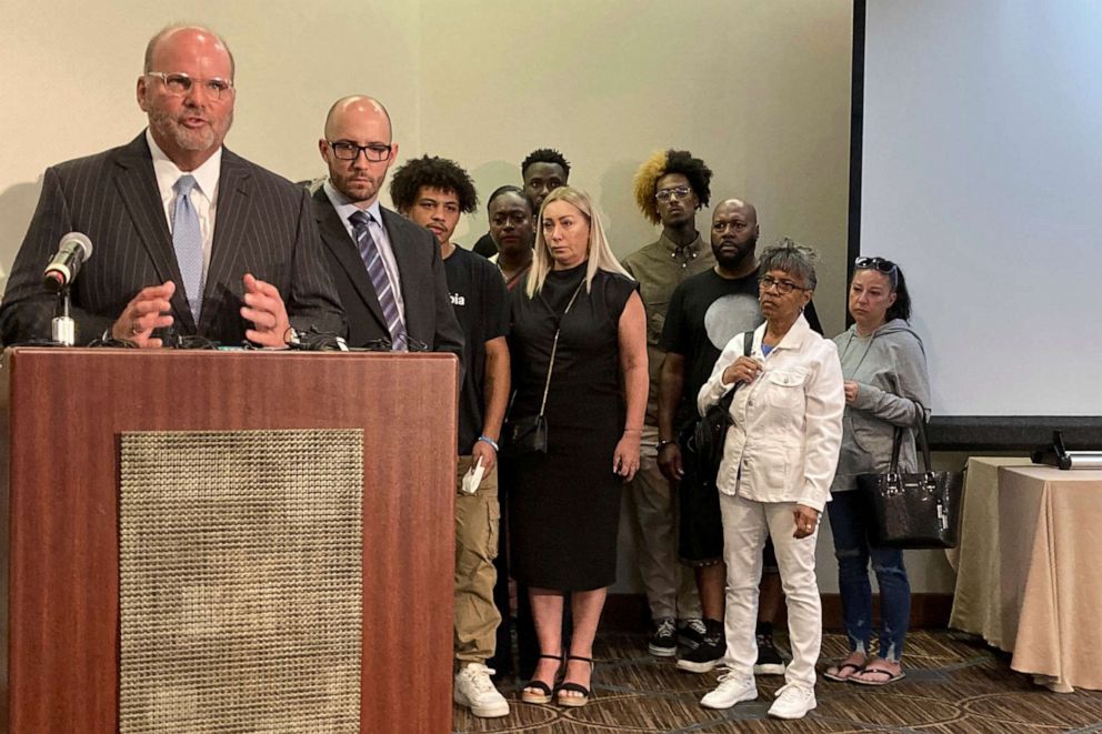 PHOTO: Attorney Rex Elliott addresses reporters with the extended family of Donovan Lewis behind him, on Sept. 1, 2022, in Columbus. Ohio. 
