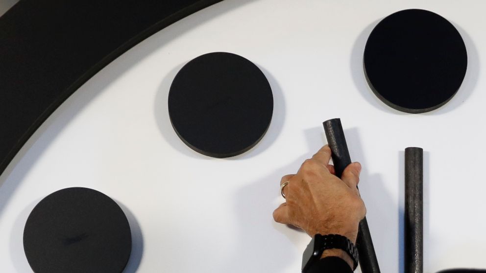 PHOTO: Robert Rosner, chairman of the Bulletin of the Atomic Scientists, moves the minute hand of the Doomsday Clock to two minutes to midnight during a news conference at the National Press Club in Washington,D.C.,Jan. 25, 2018.