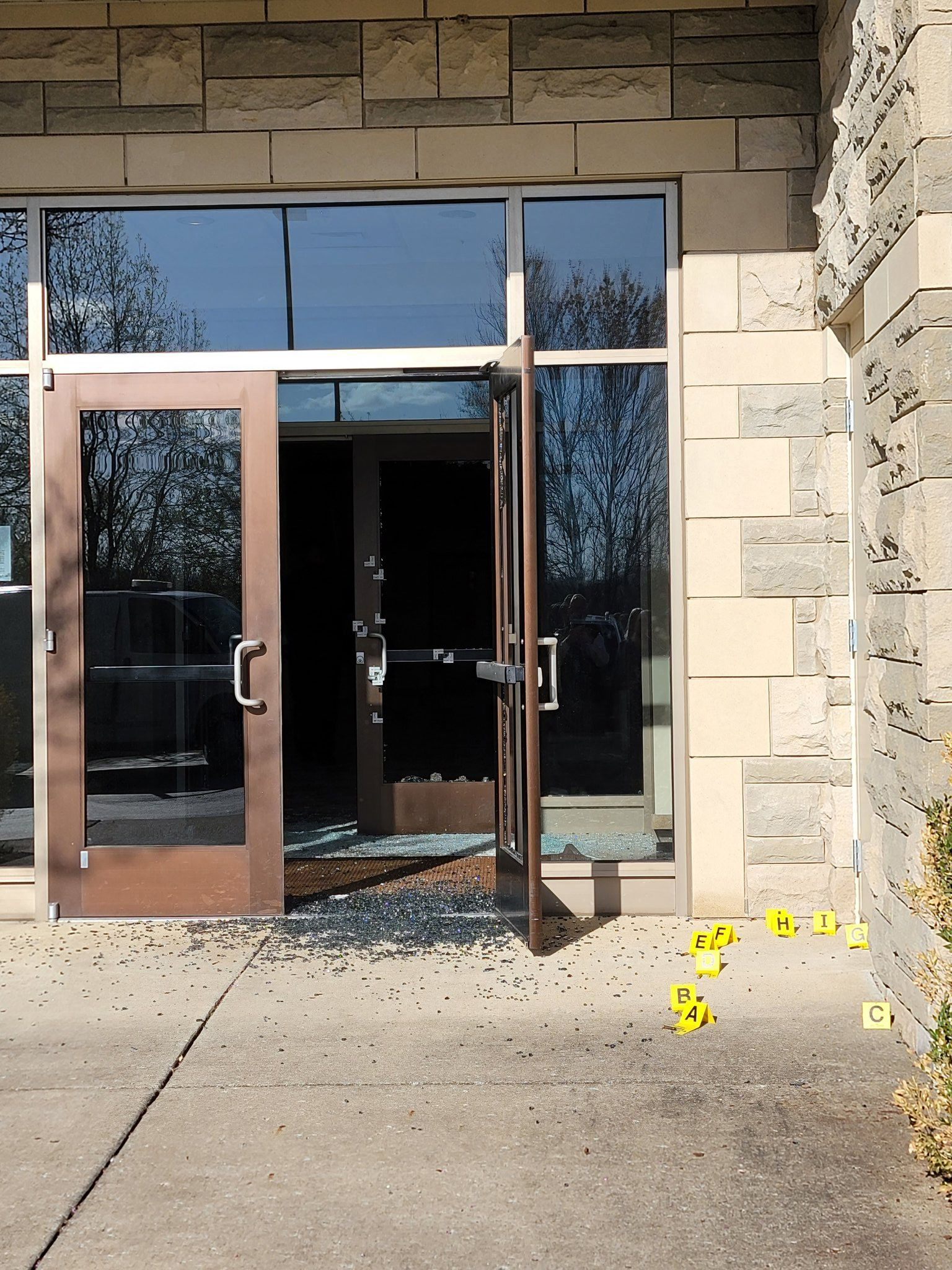 PHOTO: The broken glass doors the shooter fired at to enter the Covenant School building at the Covenant Presbyterian Church, in Nashville, Tenn., March 27, 2023.