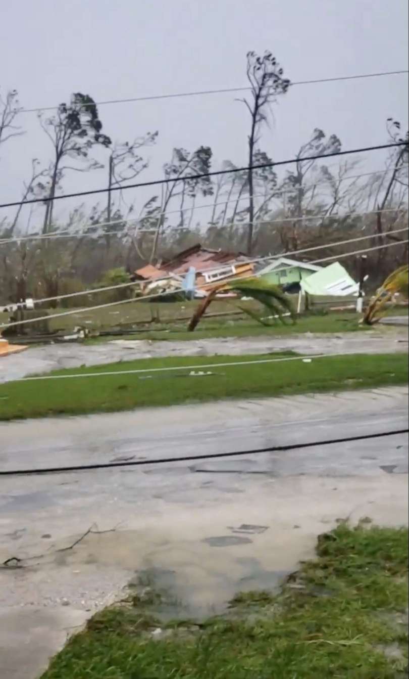 PHOTO: Uprooted trees, fallen power lines and the debris from damaged houses scatter on a road as Hurricane Dorian sweeps through Marsh Harbour, Bahamas, Sept. 1, 2019.