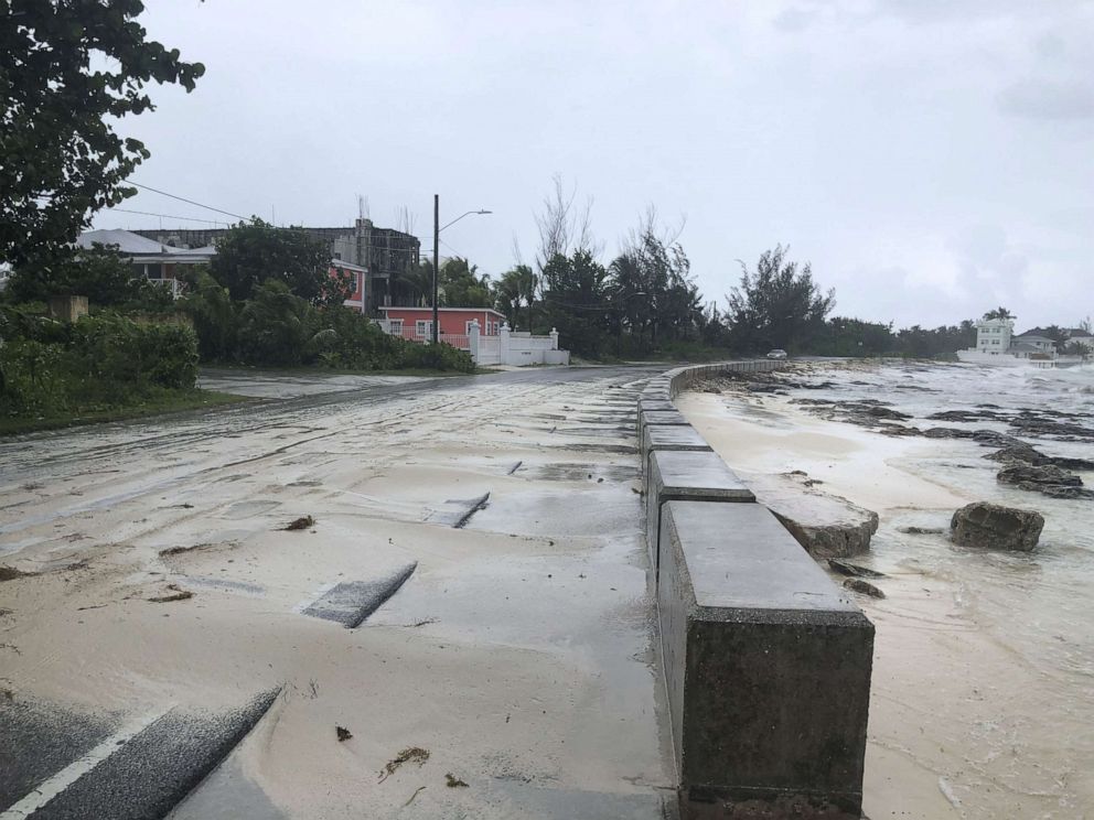 PHOTO: Sand pours on to a road near the beach during the approach of Hurricane Dorian, Sept. 1, 2019, in Nassau, Bahamas.