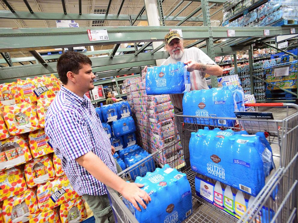 PHOTO: Residents Al-Muthanna Al-Ani (L) and Lloyd Strickland buy supplies in preparation for Hurricane Dorian at BJs store, Aug. 29, 2019, in Orlando, Fla.