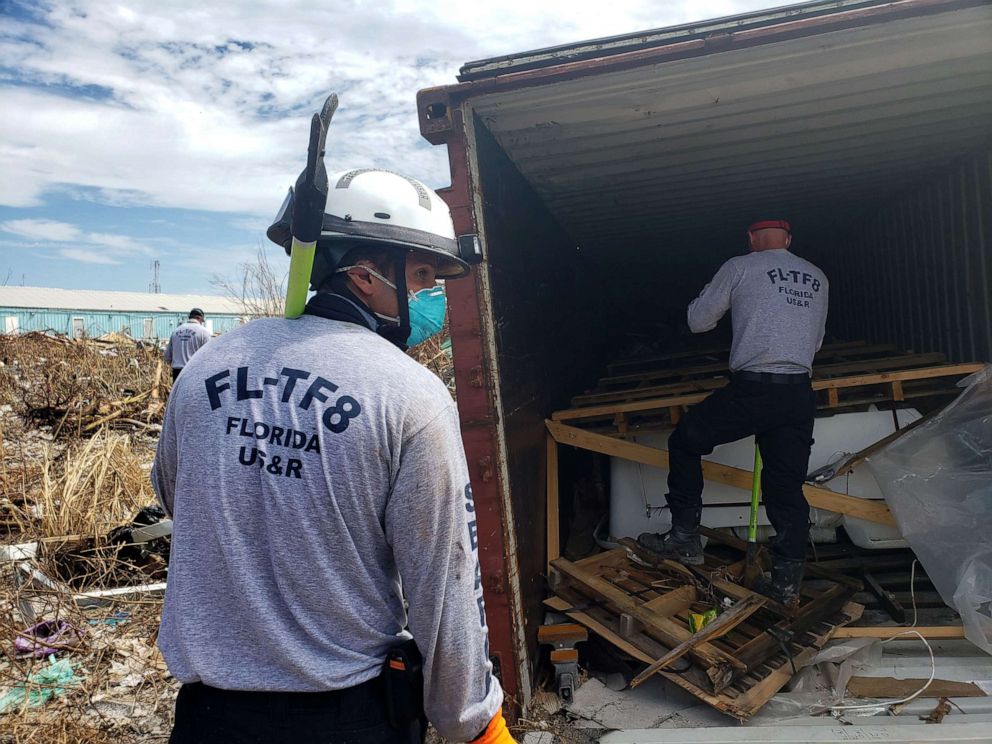 PHOTO: Florida fire Lieutenant and search and rescue volunteer Chad Belger leads a search for the dead in the destroyed Abaco shantytown called Pigeon Peas, after Hurricane Dorian in Marsh Harbour, Bahamas, Sept. 8, 2019.