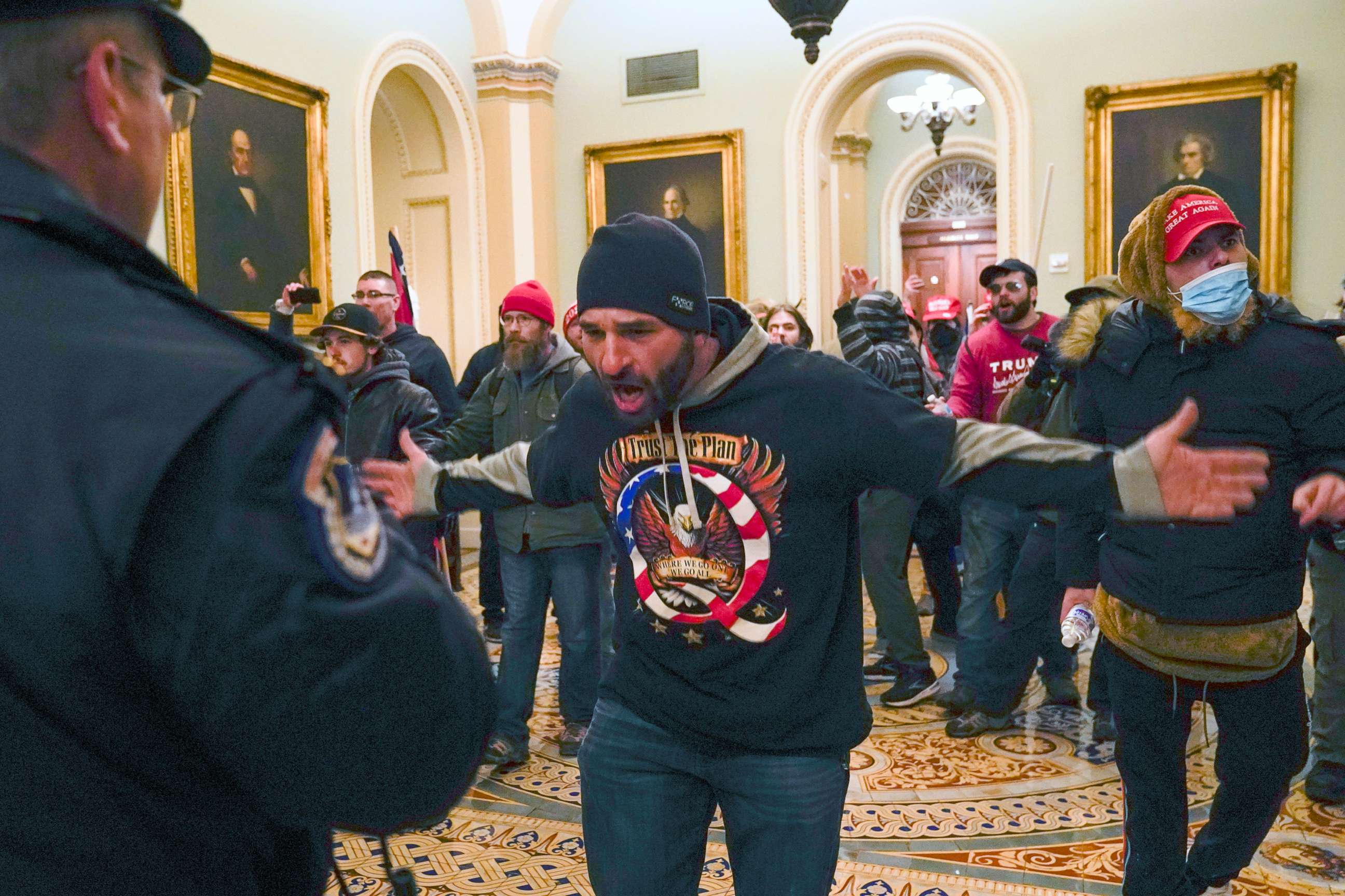 PHOTO: In this Jan. 6, 2021, file photo, Trump supporters, including Doug Jensen, center, confront U.S. Capitol Police in the hallway outside of the Senate chamber at the Capitol in Washington.