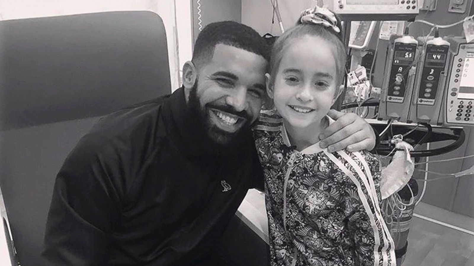 This Monday, Aug, 20, 2018 photo provided by the rapper Drake shows him posing with Sofia Sanchez, at Lurie Children's Hospital in Chicago.