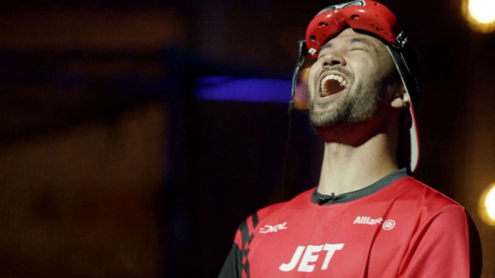 PHOTO: Professional DRL drone racer Jordan 'JET' Temkin throws his head back in disappointment after losing a race.