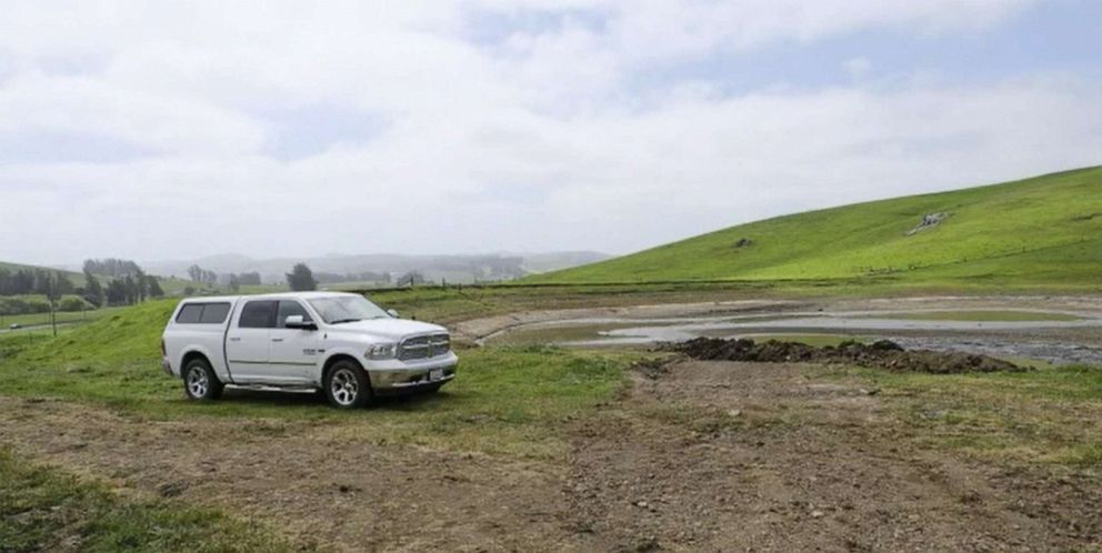 PHOTO: Cattle rancher Don  DeBernardi stands on the end of his reservoir pond which is a much lower levels than previous years due to drought in Petaluma, Calif. 