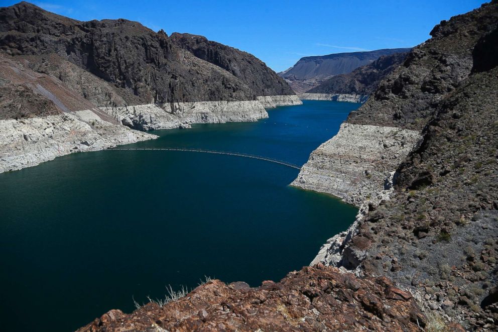 PHOTO: Water lines show the low levels of water on the banks of the Colorado River at the Hoover Dam in Arizona, May 31, 2018.