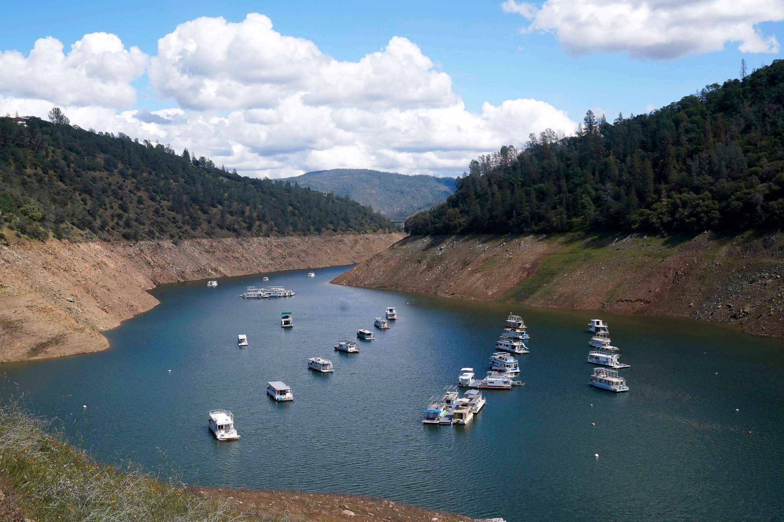 PHOTO: Houseboats sit in the drought lowered waters of Oroville Lake, near Oroville, Calif., April 19, 2022.