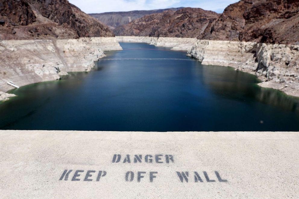 PHOTO: A 'Danger' sign is displayed on the Nevada side of the Hoover Dam, with drought-stricken Lake Mead in the background, in the Lake Mead National Recreation Area, Nev., May 10, 2022.